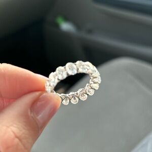 Oval cut moissanite eternity band in 10k white gold with 6x4mm stones